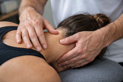 ostheopath practicing on client  